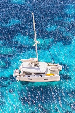 Catamaran anchored in clear water