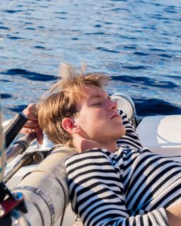 Man sleeping on a sailboat